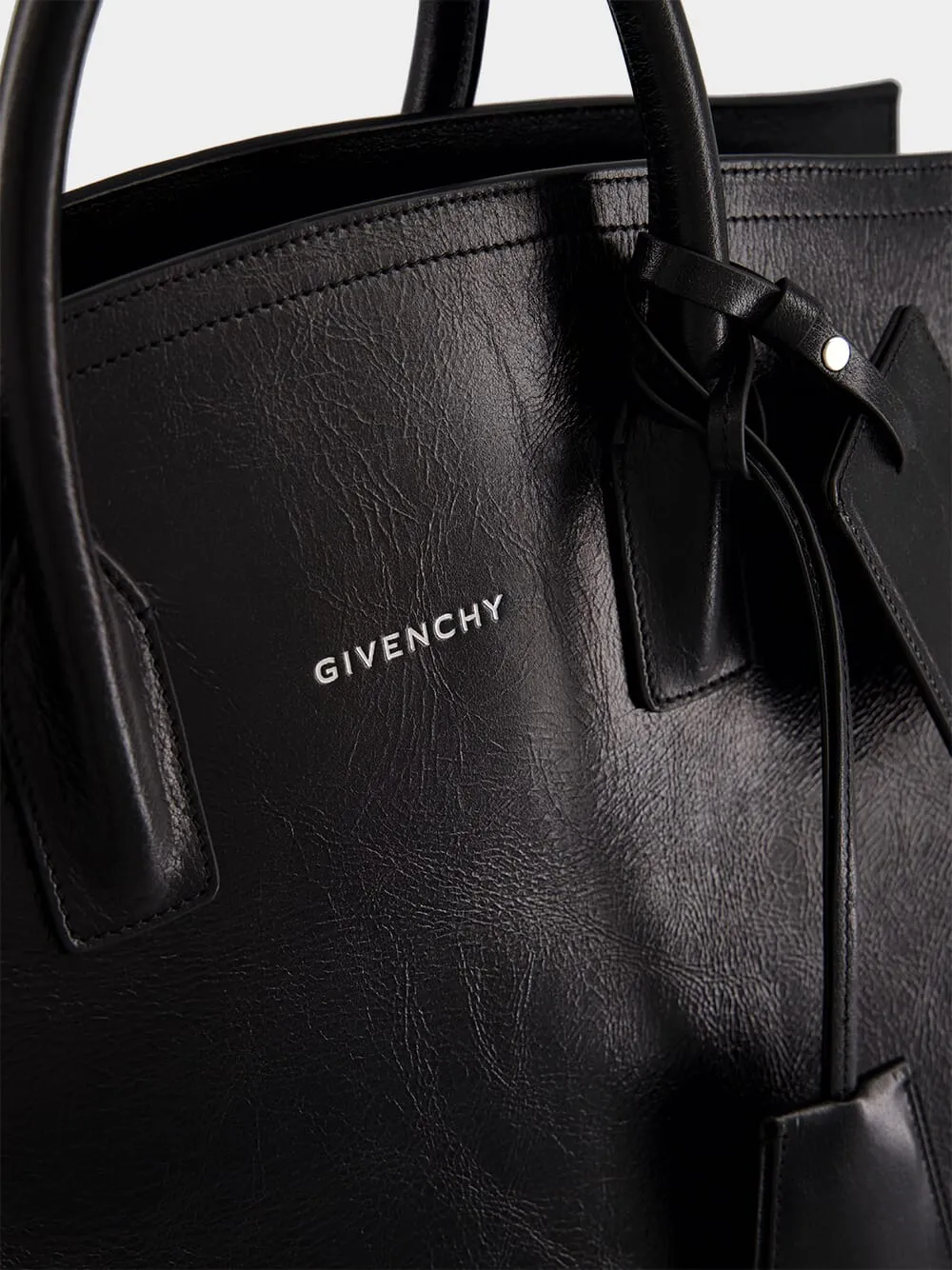Black Leather Travel Bag with Silvery Hardware