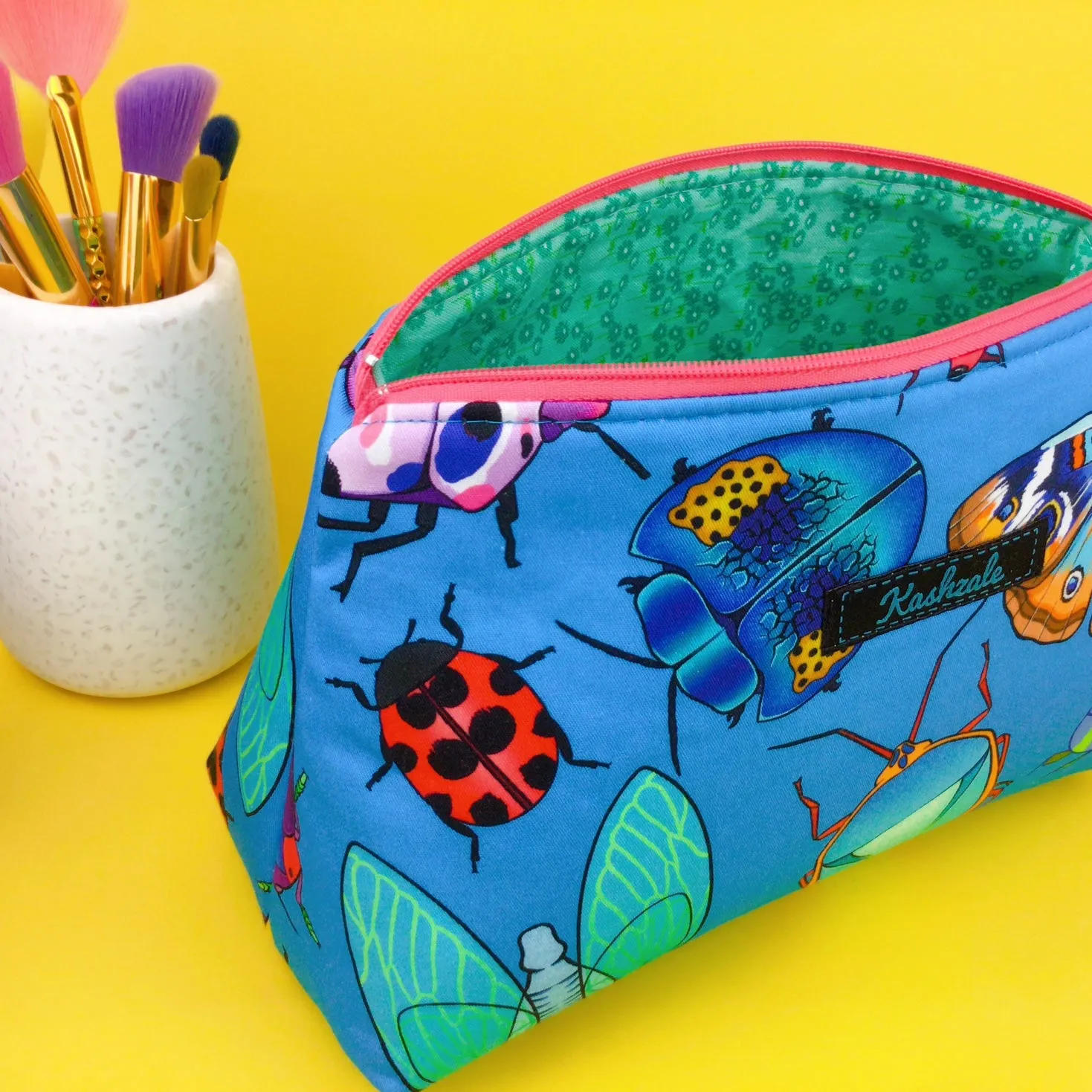 Buggin Blue Medium Makeup Bag. Kasey Rainbow Design.